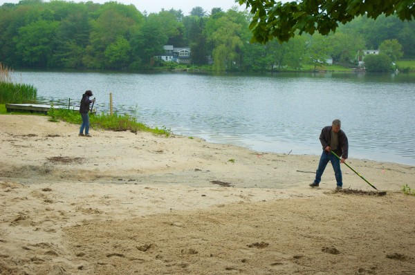Cleaning up and raking the beach